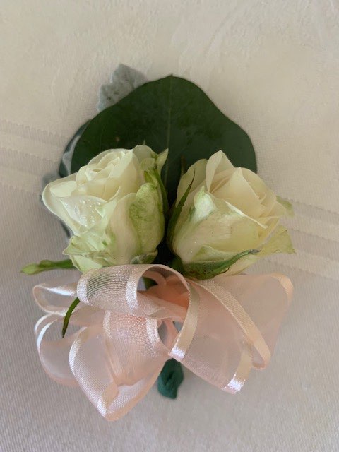 Double white rose pin corsage with ribbon