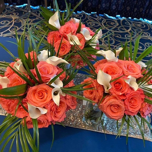 Orange rose and white calla lily centerpieces