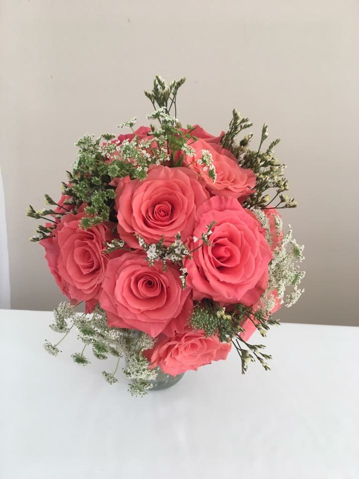 Bridal bouquet of pink roses and Queen Anne's lace