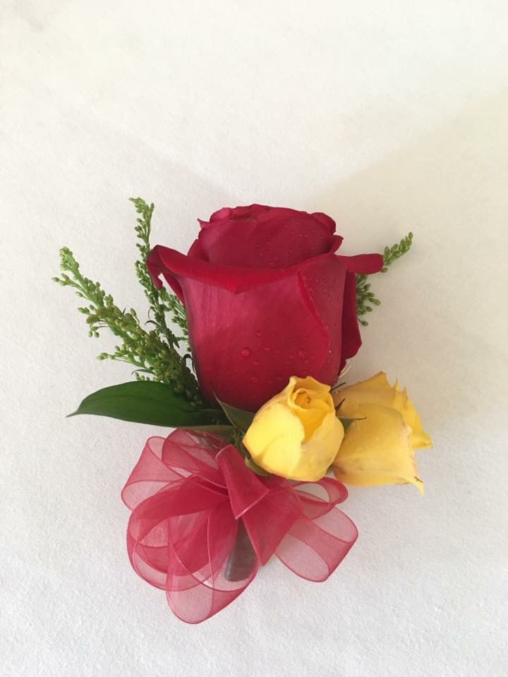 Red rose pinned corsage