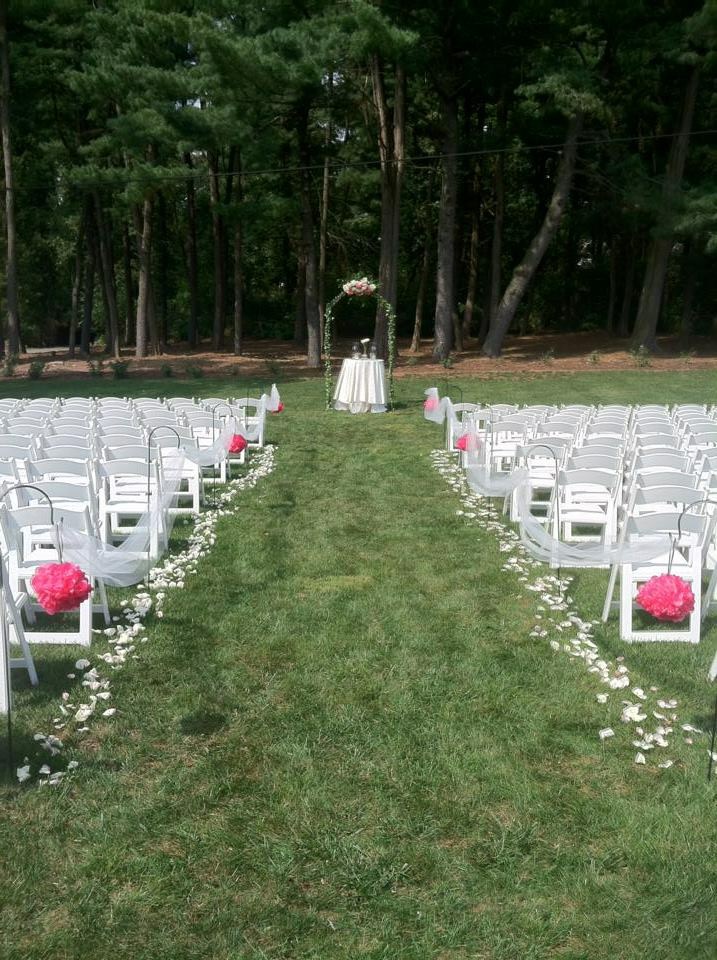 Rose petals lining a ceremony aisle