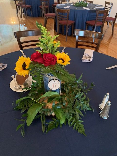 Sunflower and red rose centerpiece