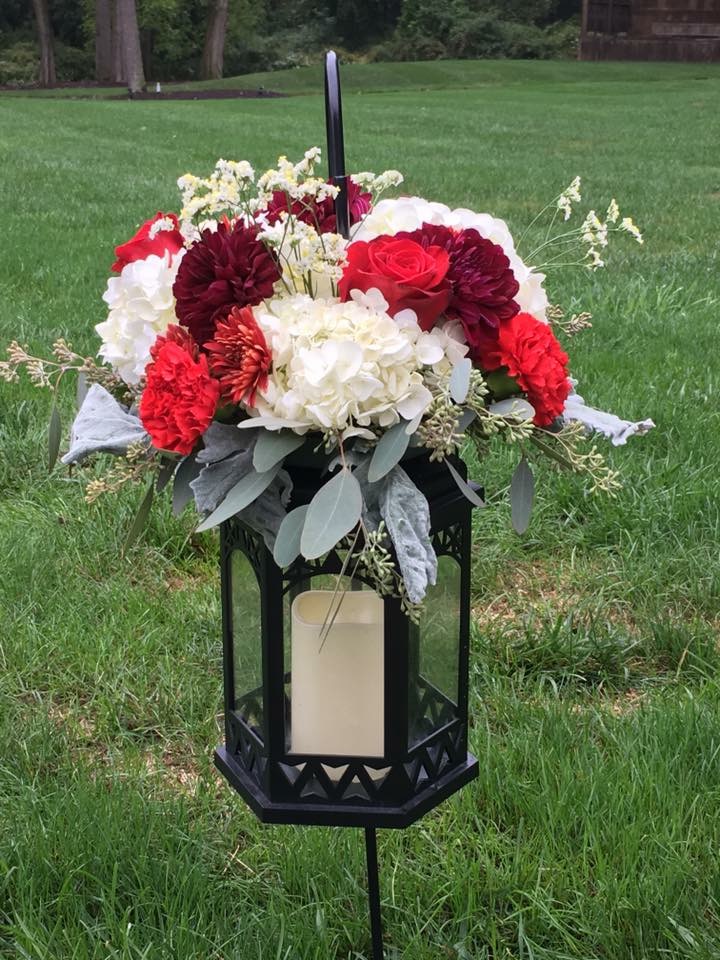 Ceremony floral ring of white hydrangea and burgundy roses