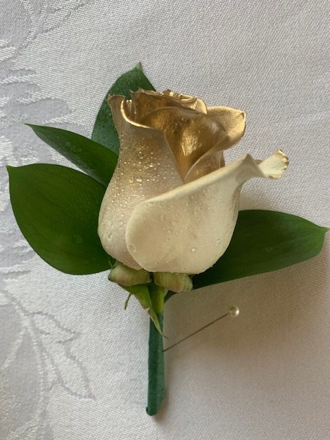 Gold-tipped white rose boutonniere